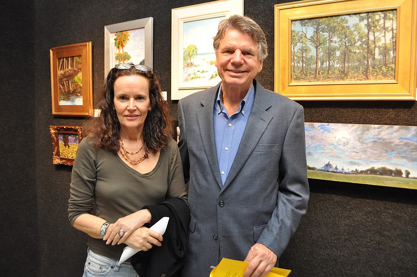 Dixie Harrison and Greg Biolchini look at paintings in â€œPaint Sarasota: Light Chasersâ€ in Gallery 3