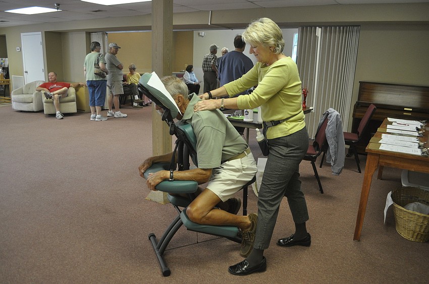 Liz Yerkes gives Marv Herpel a back massage.