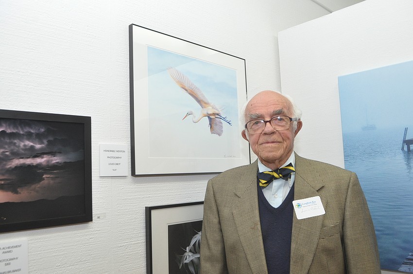 Louis Cabot with his egret photo, which earned an honorable mention.