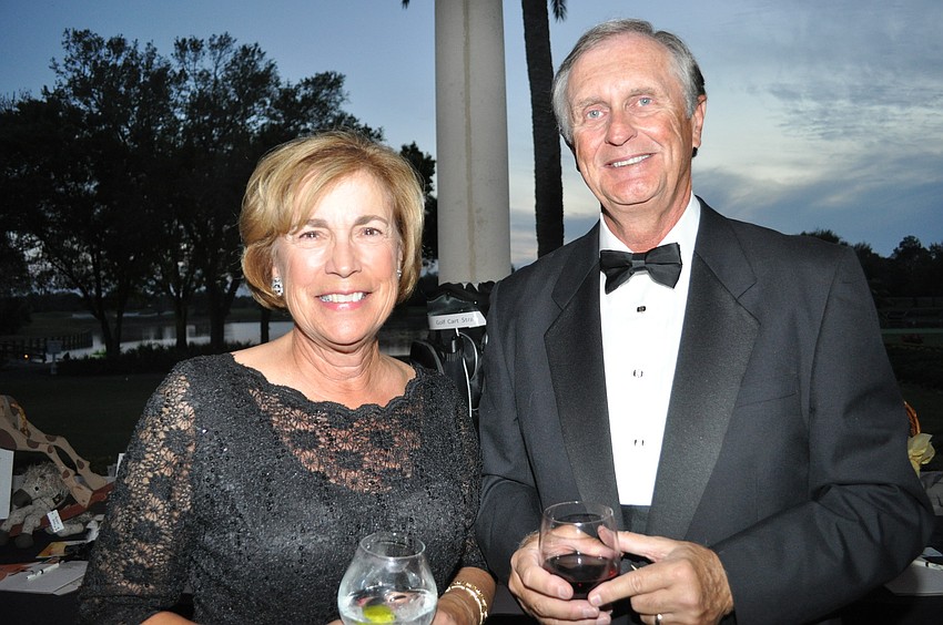 Libby Edwards and Mike Katgs, who looked to win a golf bag in the auction