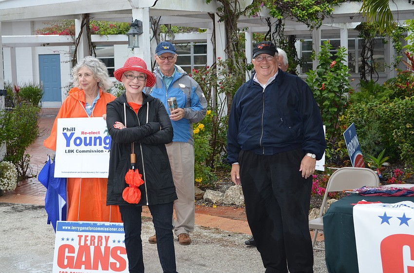 Diane and Terry Gans greet voters at Longboat Island Chapel Tuesday.