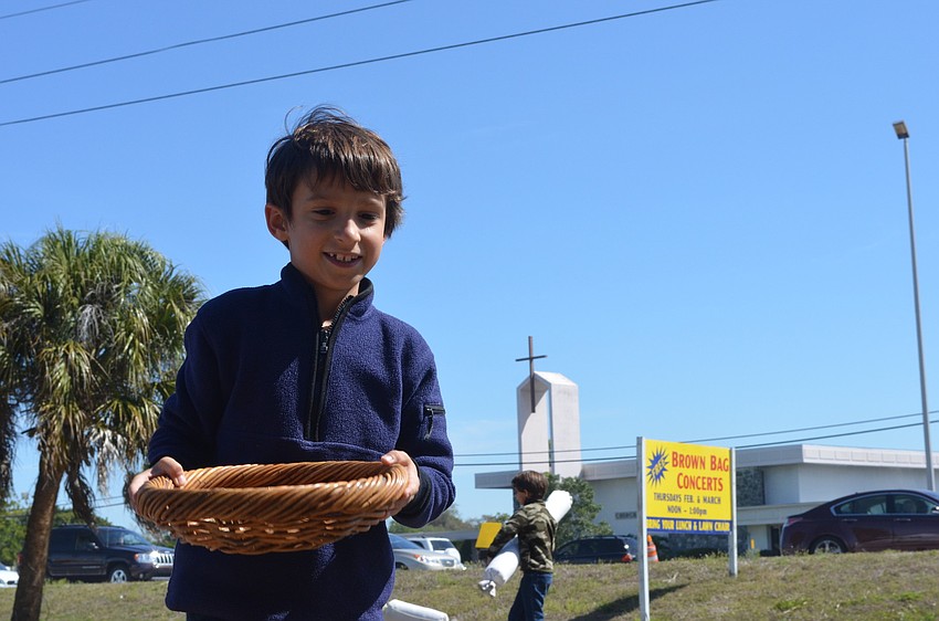 Devin Gulliver tries to catch beanbags in a basket in Pinocchioâ€™s Land.