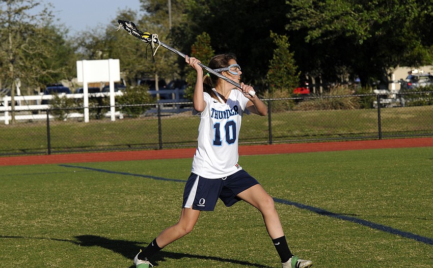 ODA seventh-grader Lexi Murphy passes the ball down the field in the second half.