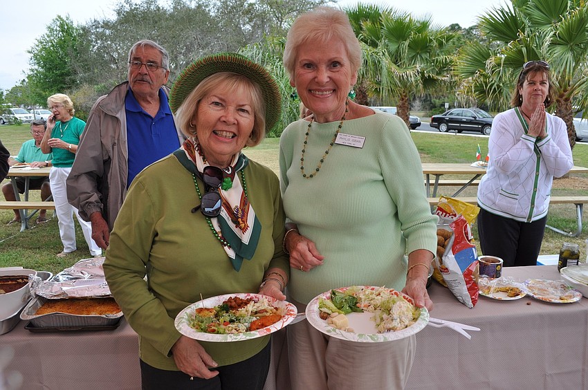 Julie Brady and Phylis Isban fill up their plates.