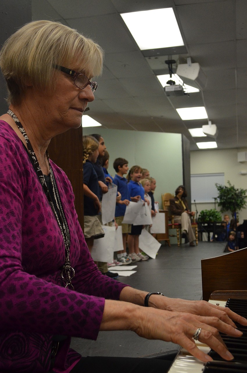 First grade teacher Shari Metcalf plays 