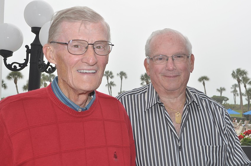 John Brouder and John Bailey tend bar.