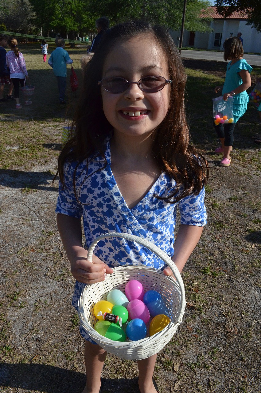 Claire Ordona shows off the eggs she found.