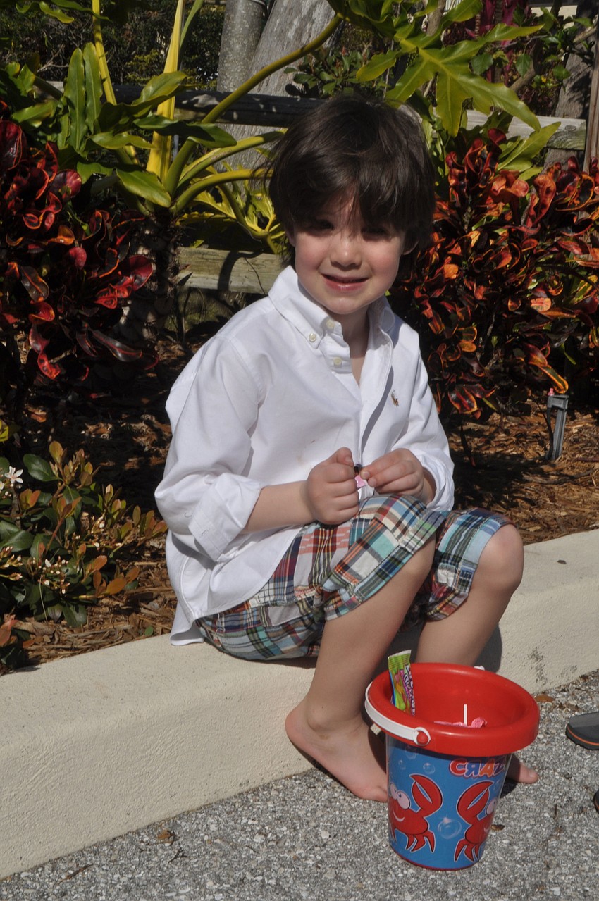 Luke Vanecko, 5, examines his loot.