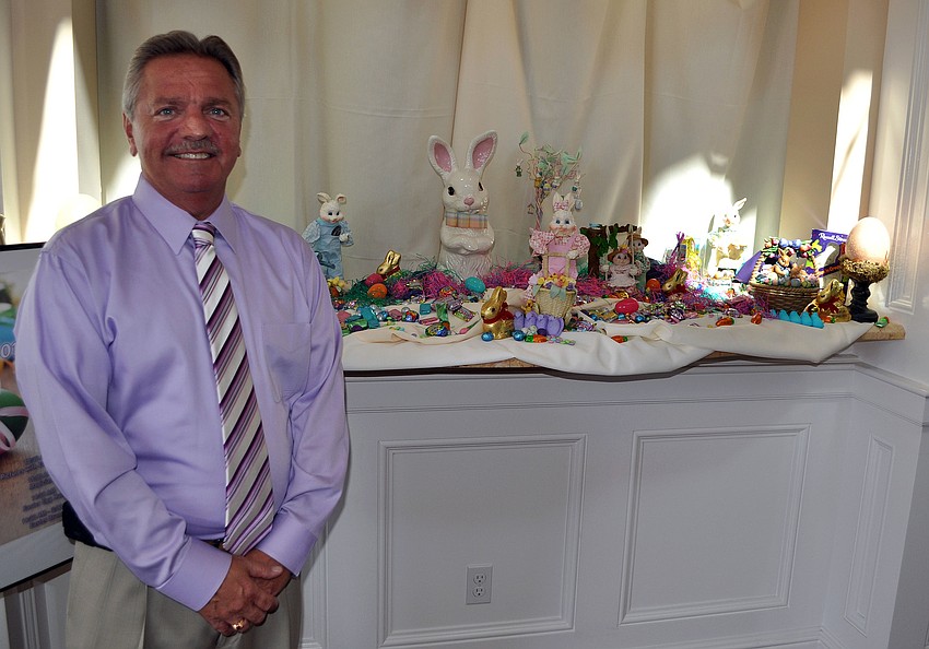 Rob Edwards stands next to his Easter display inside Bird Key Yacht Club.