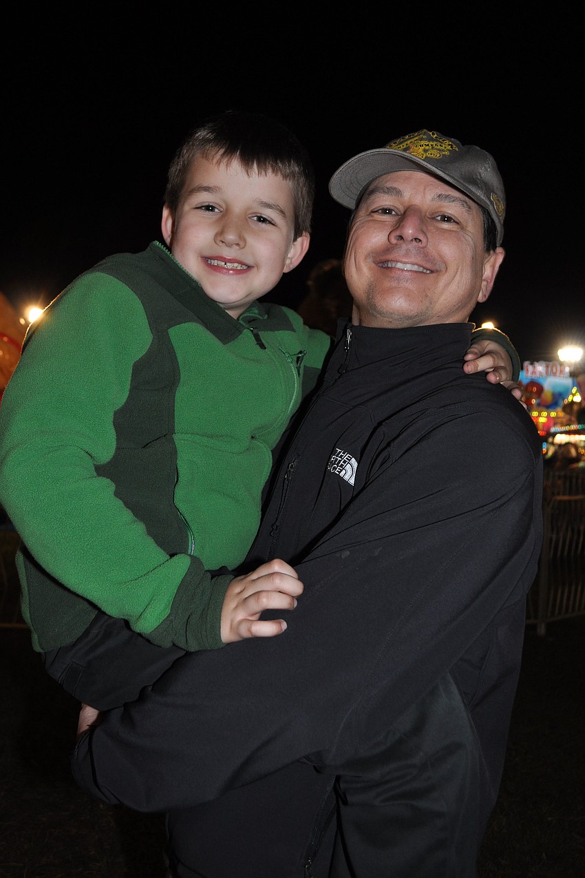 Remington Heberlee, 8, got a ride from his dad, Vaughn.