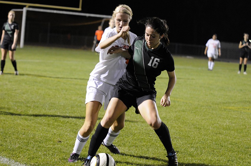 Lakewood Ranch midfielder Lindsay Martinez attempts to maintain possession for the Lady Mustangs.