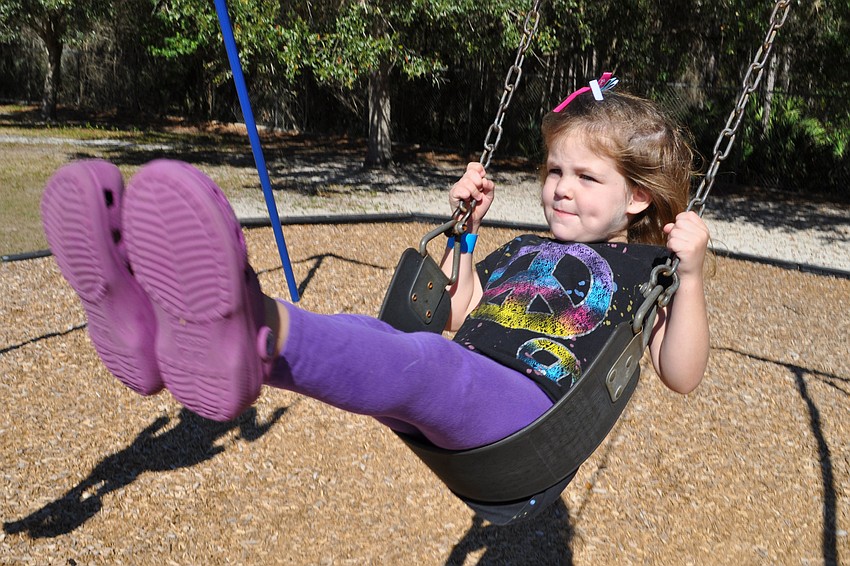 Keaton Schooley, 4, swang alongside her sisters, Brie and Shae, not pictured.
