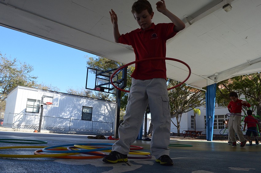 Cade Norman, 8, shows off his hula hooping skills.