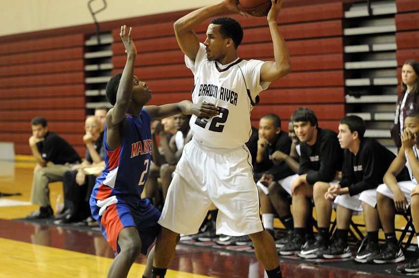 Braden River junior guard Zechariah Kendall searches for an open teammate to pass the ball to in the third quarter.