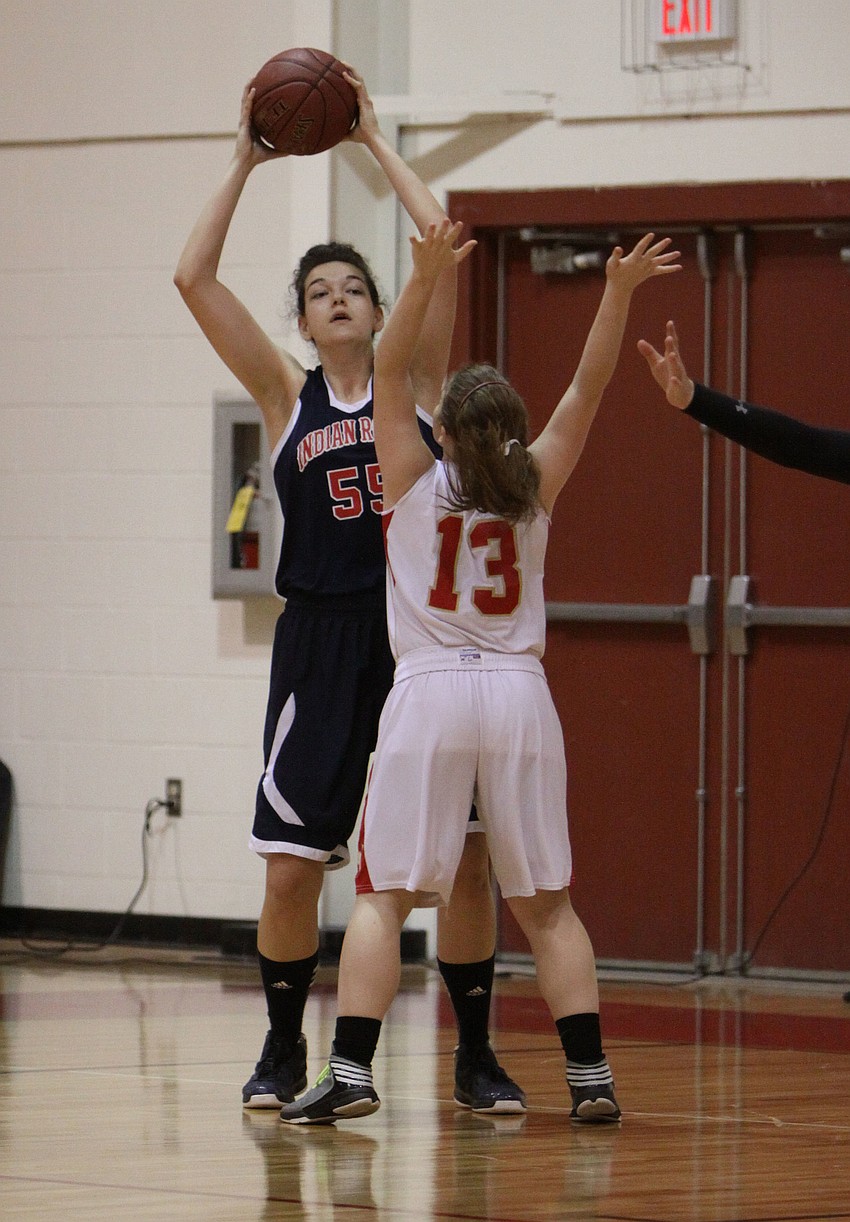 Indian Rocksâ€™ Rachel Boyette, No. 55, looks to pass the ball while Cardinal Mooneyâ€™s Quinn Incardona, No. 13, tries to stop her from passing.