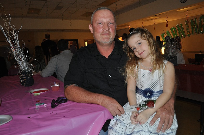 Nick Davis, attending his seventh father/daughter dance, and his daughter, Savannah