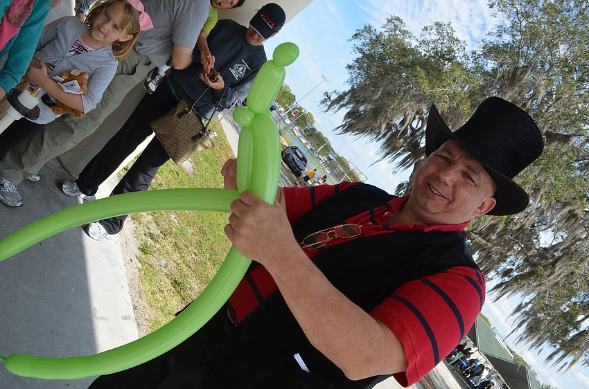 Wayne Fitzpatrick makes balloon creations for children.