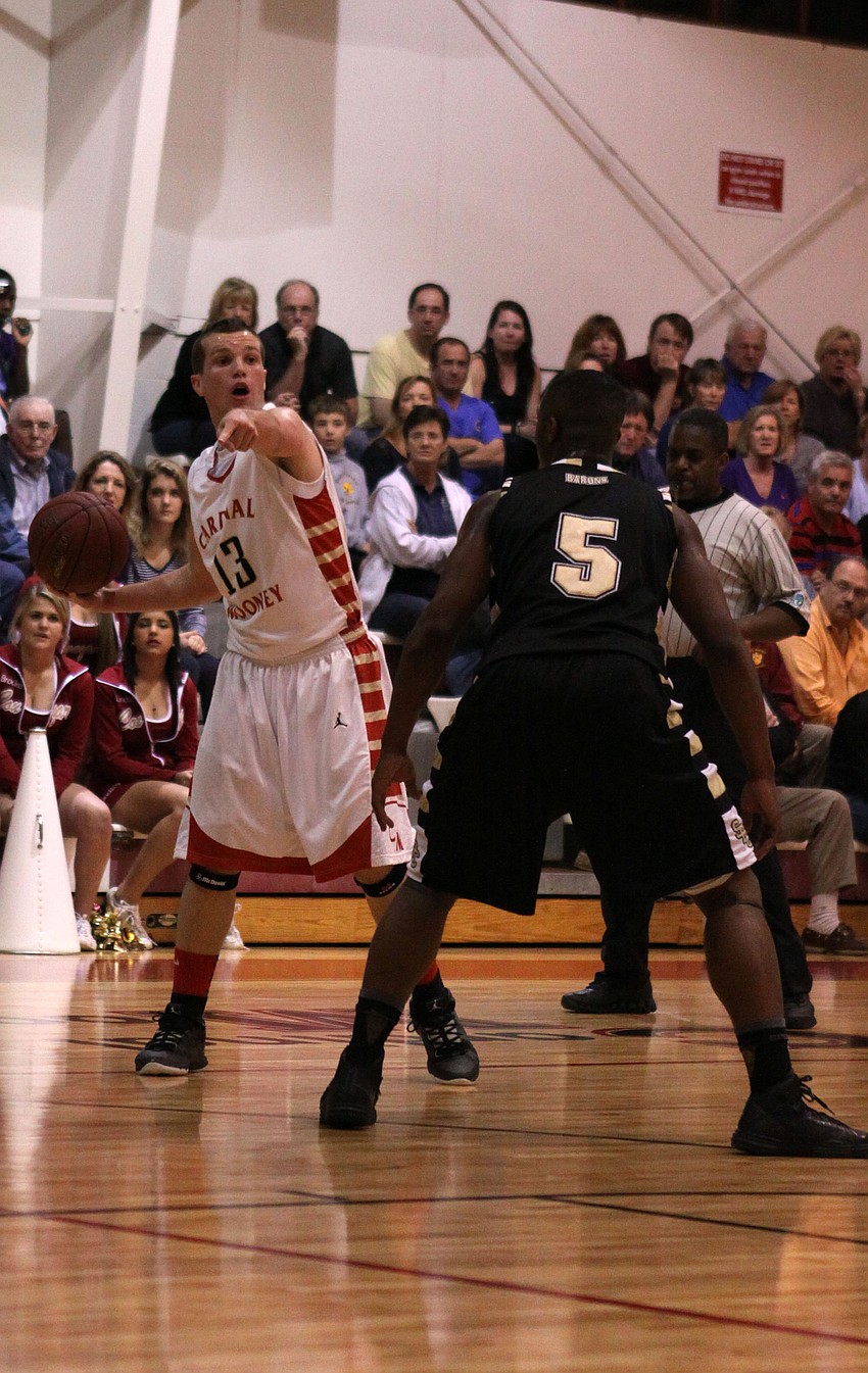 Cardinal Mooneyâ€™s Parker Del Medico, No. 13, talks to his teammates while St. Petersburg Catholicâ€™s Ryan Green, No. 5, attempts to block Del Medicoâ€™s pass.