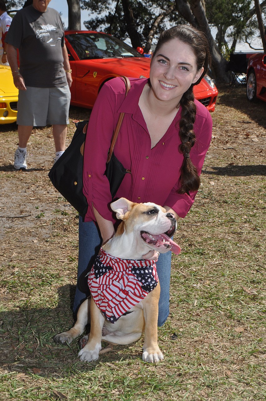 Hailey Dickert and Bubba, her English bulldog, enjoy a sunny day at the Exotic Cars festival.