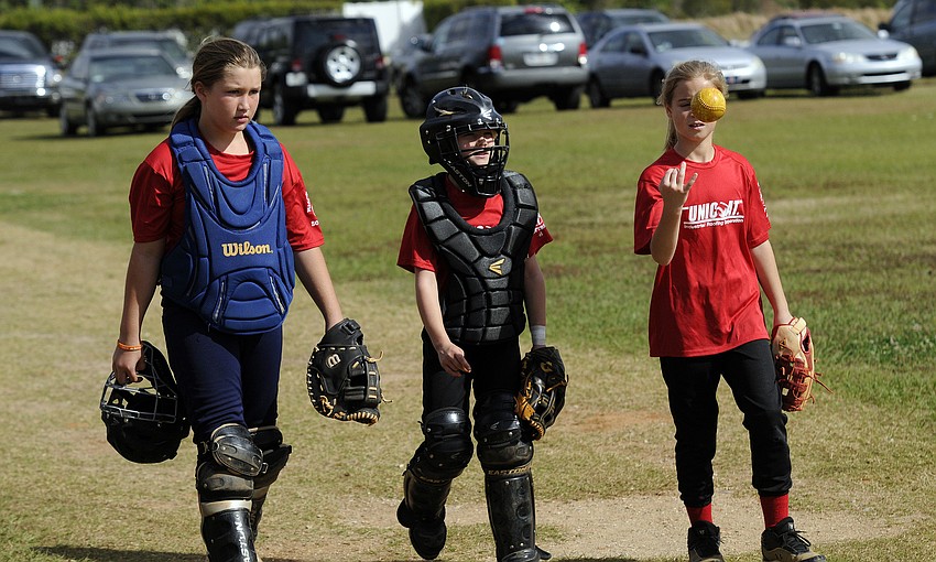 Mikayla Desantis, 10, Grace Hogie, 9, and Alissa Kessler, 9, all play for Unicoat in the 10U division.