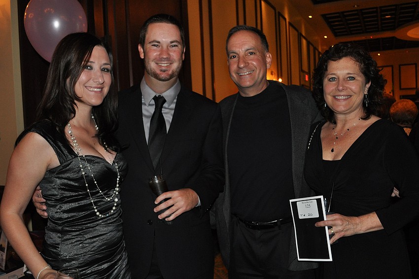 Ariana Desantis, boysâ€™ golf coach Chris Kennedy and Robert and Kathy Lees
