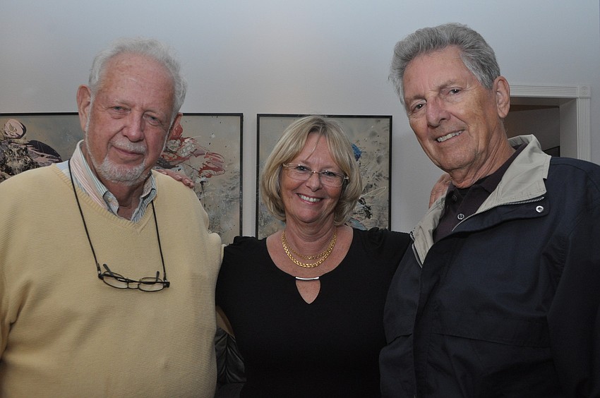 Christina Filkins, bookended by former mayors George Spoll, left, and Ron Johnson, right
