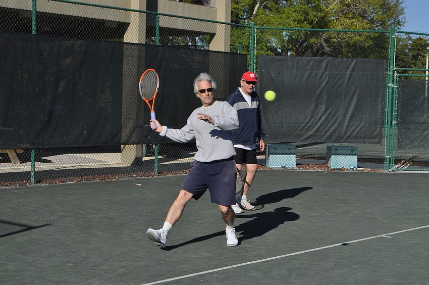 Jim Pappas takes a looped backswing for a forehand groundstroke.