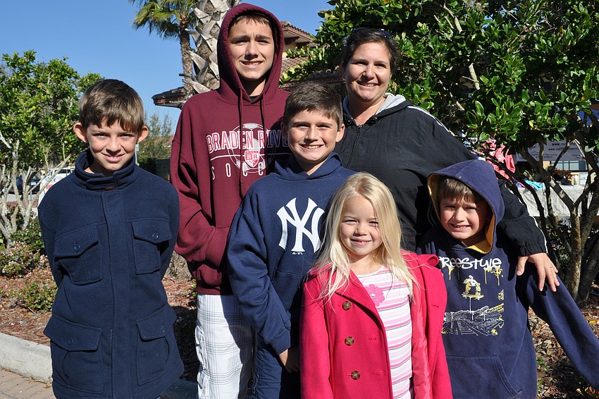 Children Johnny Little, Cory and Evan Albrecht, Emma Little and Nathan Albrecht helped Tia Albrecht man her Tiaâ€™s Treats booth.