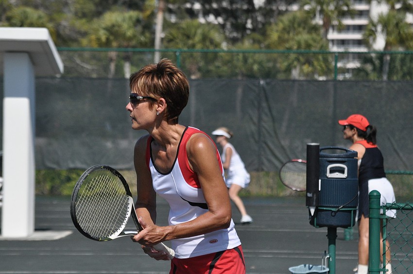 Virginia Long waits for an opportunity to poach the ball.