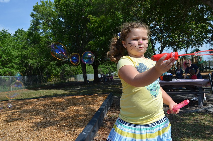 Annabelle Lewis makes bubbles.
