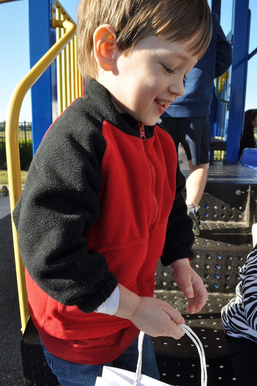Brent Workman, 3, couldnâ€™t stop smiling as he hunted for eggs.