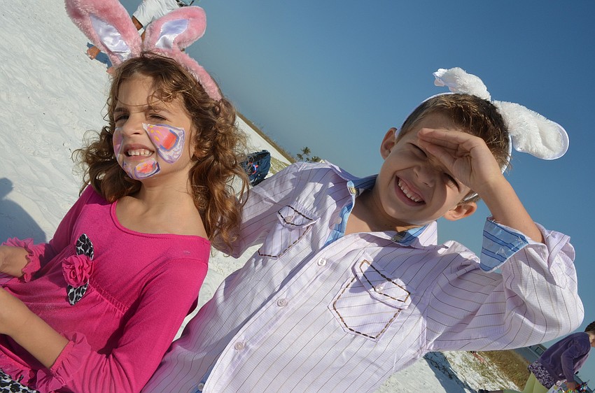 Siblings Isabella and Joseph Savage enjoy the beach after their search for Easter eggs.