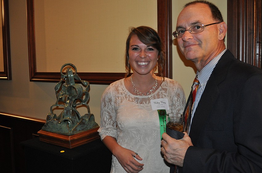 Kiley King, a Manatee High School senior, with her clay â€œRoller Coaster.â€ Chuck Freeman looked on.