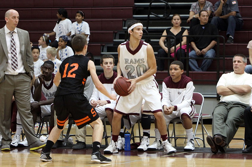 Riverviewâ€™s Josh Beychok, No. 20, looks for a teammate to pass the ball to while Sarasotaâ€™s Blake Haga, No. 12, tries to block the pass.