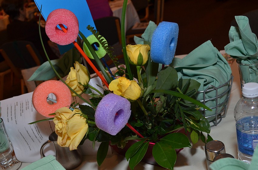 The Sarasota Garden Club made these flower centerpieces using swimming foam noodles.