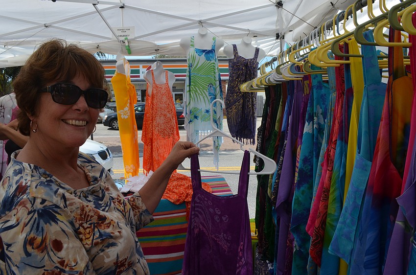 Gloria Feldmann checks out dresses from Beach Hut Sarongs.