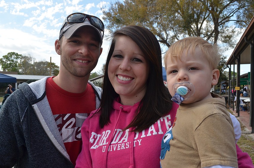 Zack and Kristen Morris with their 10 â€“ month- old Levi.