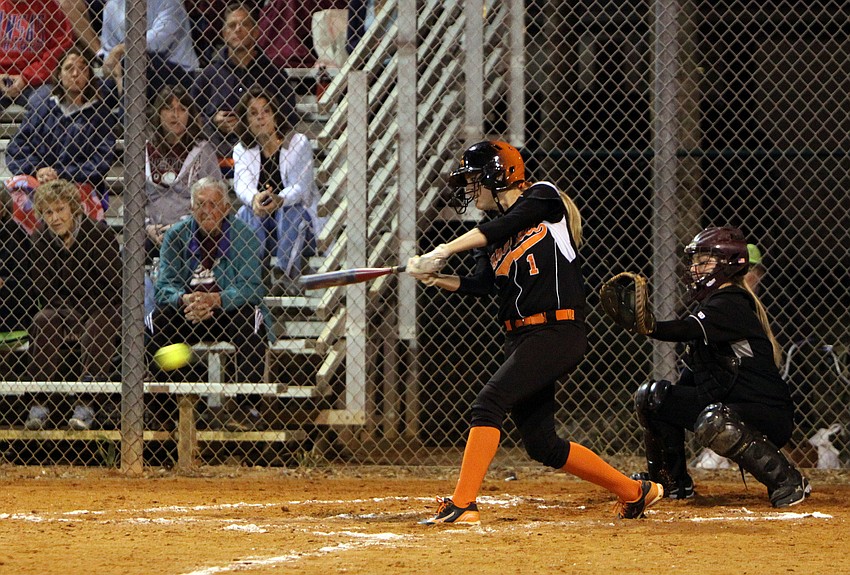 Sarasotaâ€™s Avery Miller, No. 1, hits the ball.