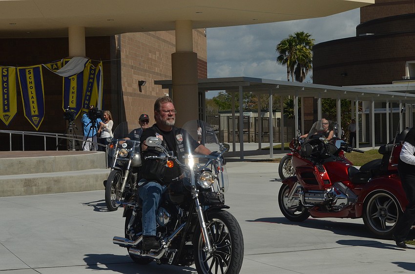 Motorcycle enthusiasts rode around the courtyard adding to the energy of the rally.
