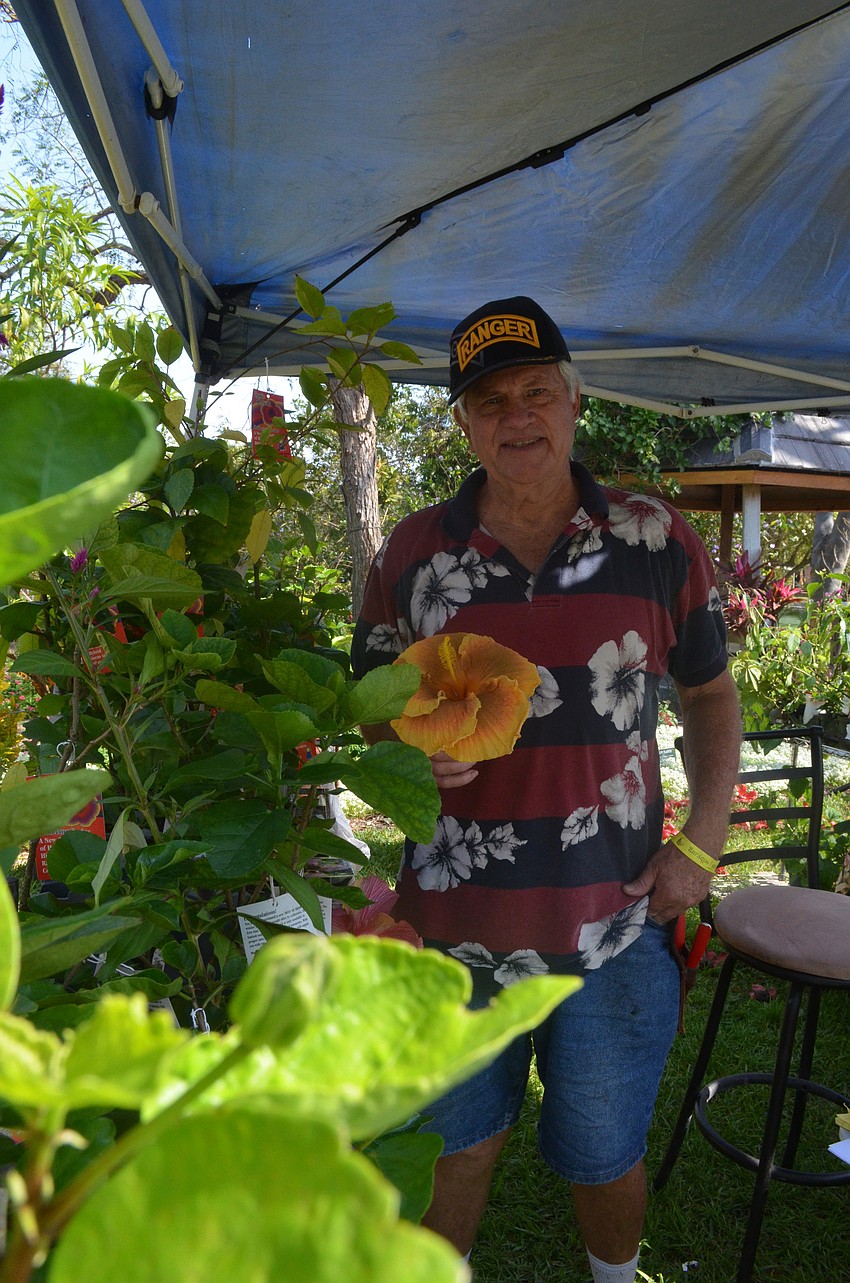 Curt Sinclair has been a vendor at the show for 7 years. He enjoys hearing people tell him about the progress of the plant they had bought from him the previous year.