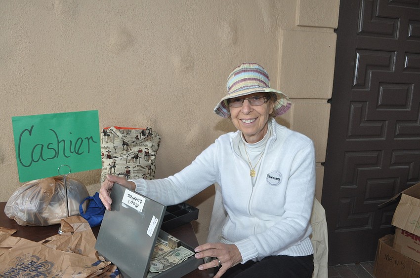 Bernadette Potosnak works the cash register