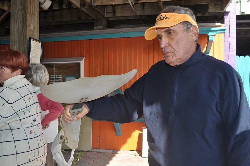 Michael Givant, who teaches birding at the Longboat Key Education Center, listens to a presentation about prosethetics.