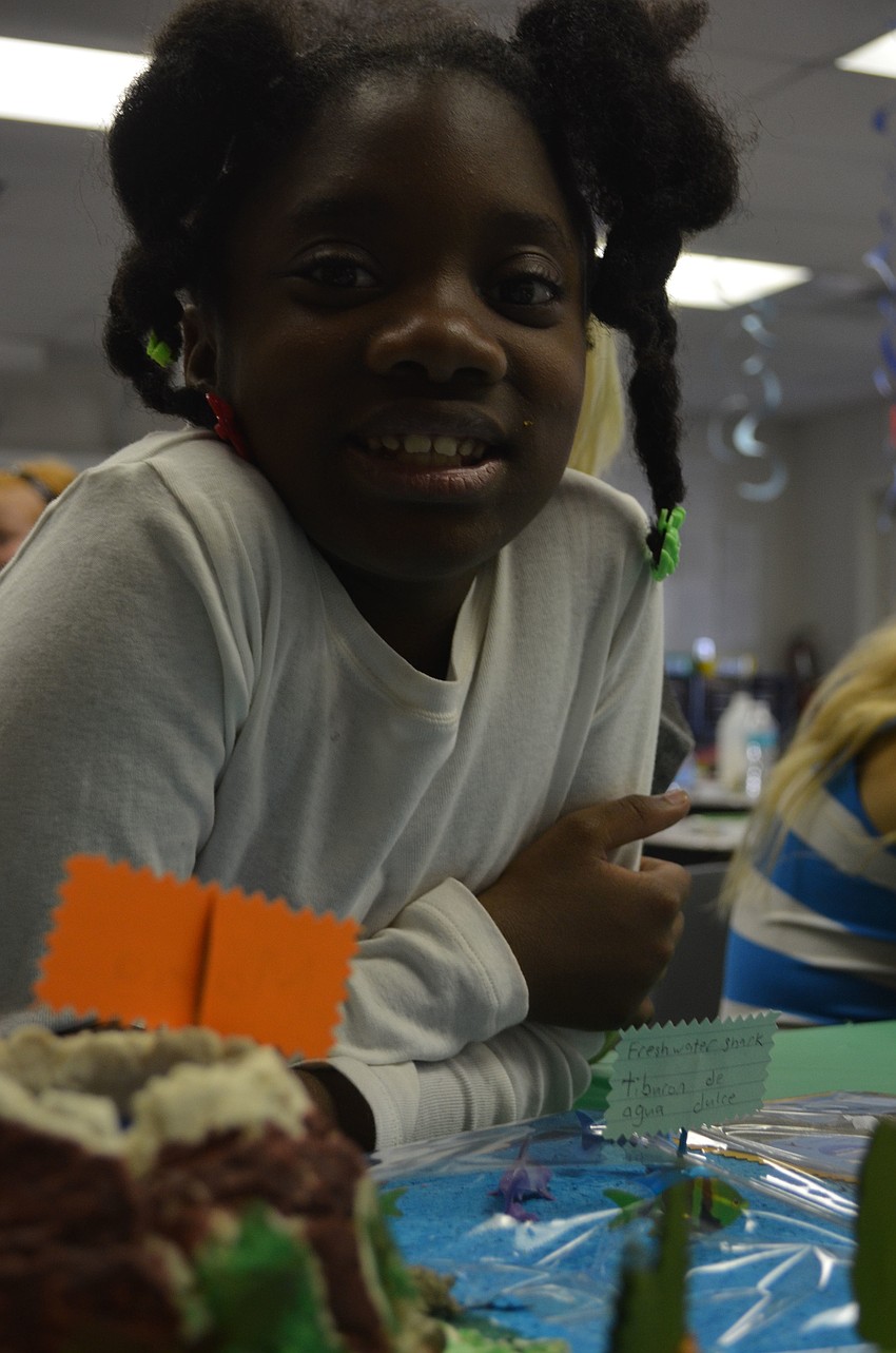 Dallas Williams checks out projects third graders made.