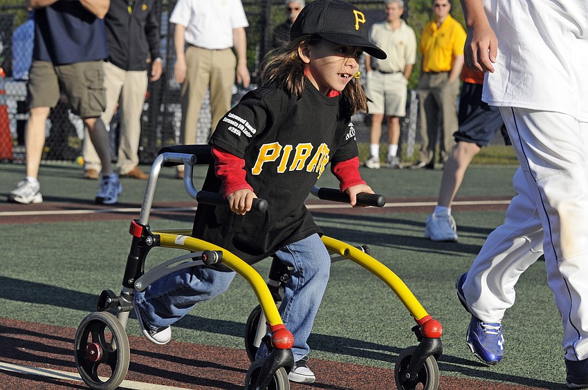 Emma Howey races down the first base line after getting a hit for the Pirates.