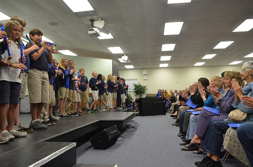 Grandparents applaud fourth graders for playing 