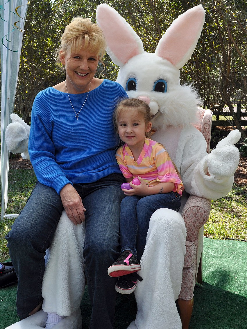 Lori Hunter and her granddaughter, Brielle Short, 4, sit on the Easter Bunnyâ€™s lap for a photo at Jungle Gardensâ€™ 12th annual Jungle Trails and Bunny Tails.