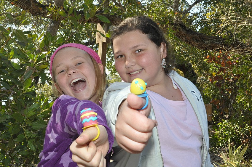 Emily Sackett, 10, and Mary Grace Cuci, 10, show off their candy rings.