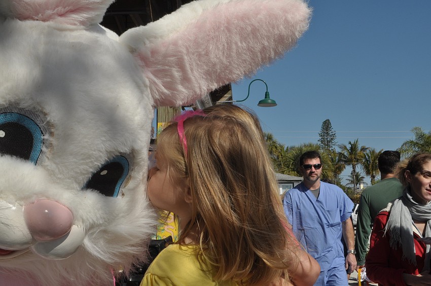 Mia Gubernat, 2, kisses the Easter Bunny.
