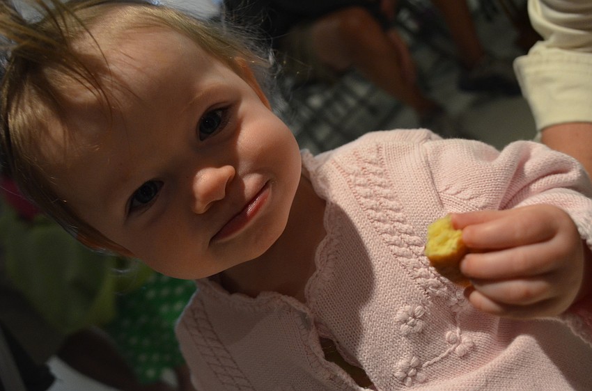 Elisa Wriston munches on a donut Saturday morning.