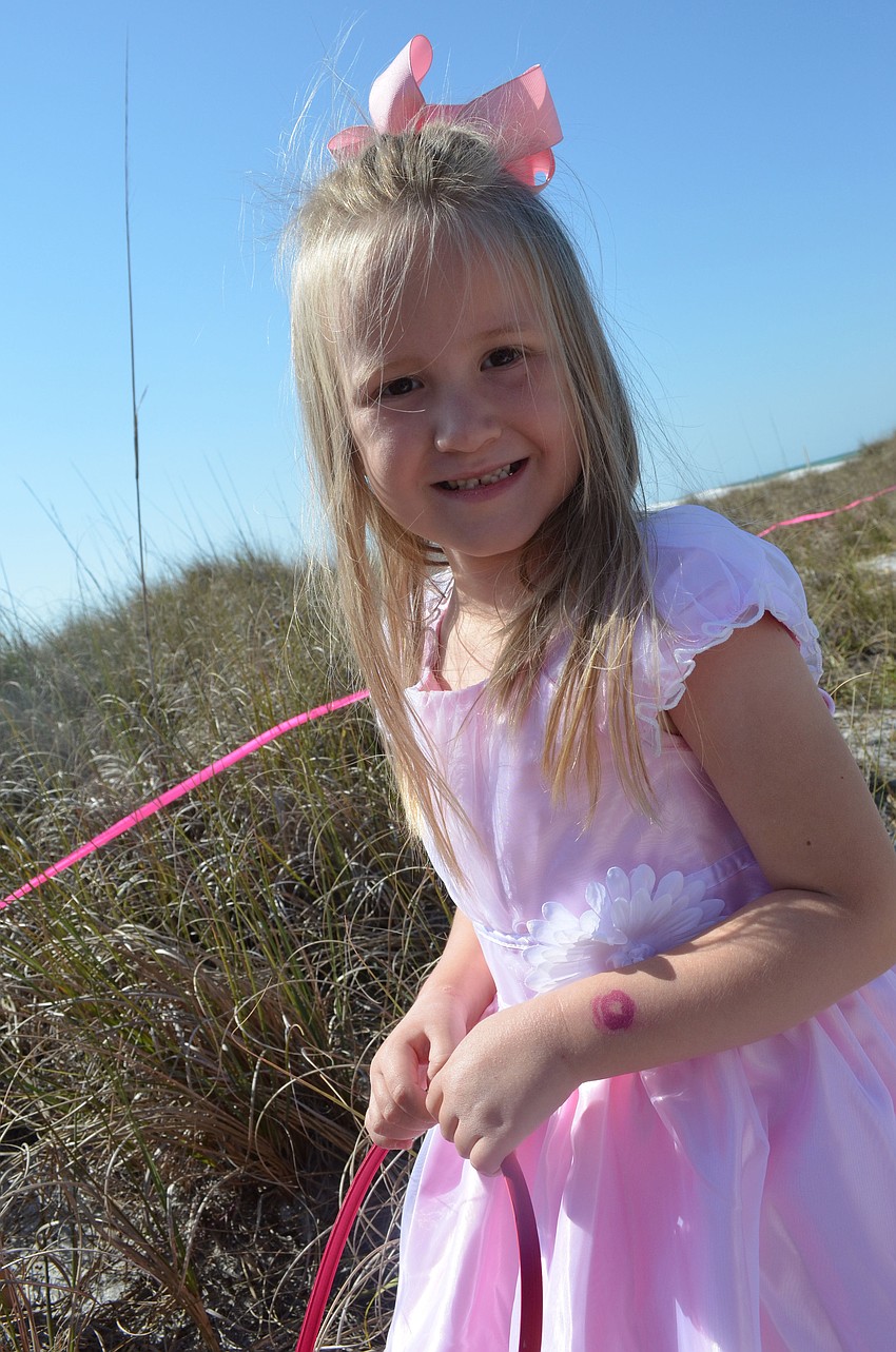 Arabella Carlson searched for Easter eggs through the grasses.